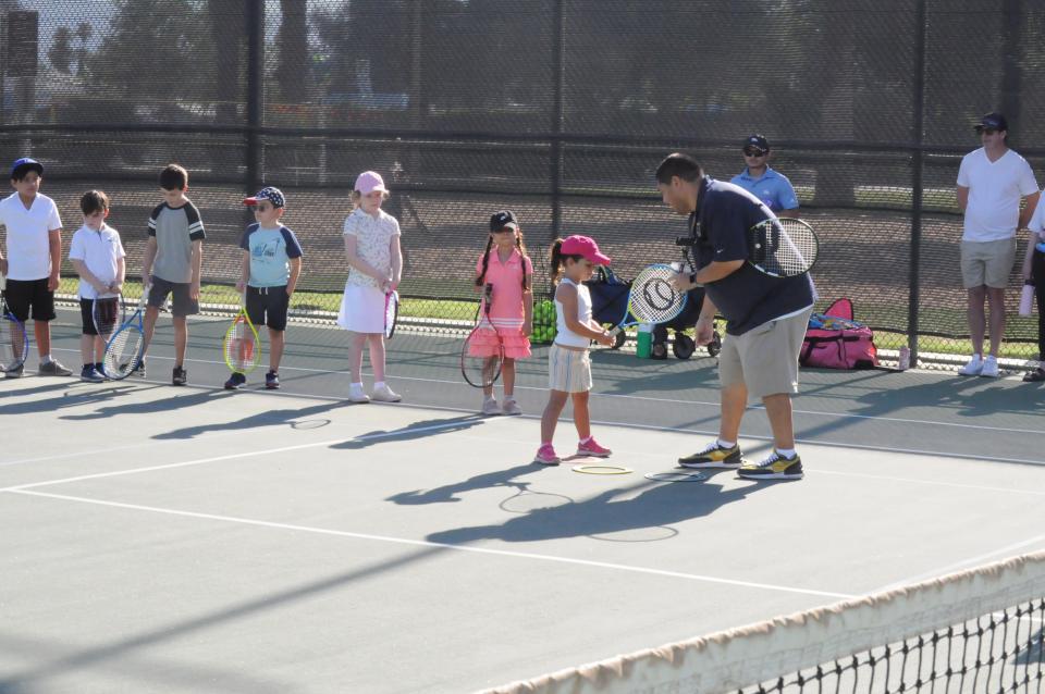 Youth on tennis court