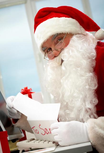 Santa Claus opening letter addressed to him