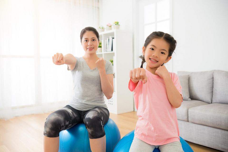 Woman and child doing indoor exercises