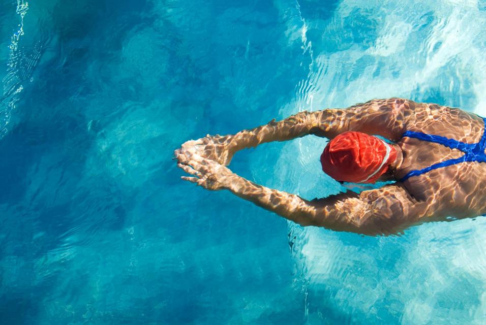 Person swimming in a pool