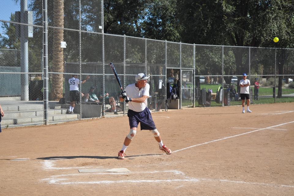 Adult playing baseball