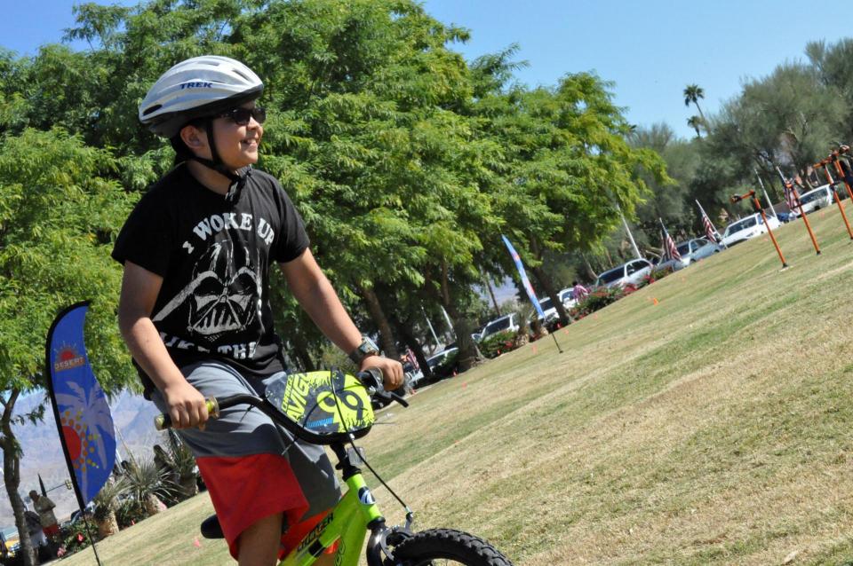 Boy Rides his Bike Across the land