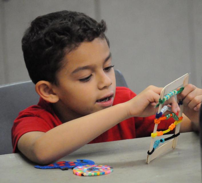 Young boy doing craft project