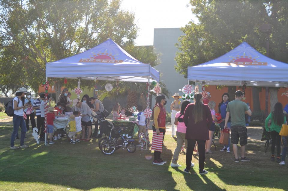 People participating in Candy Cane hunt at Indio park