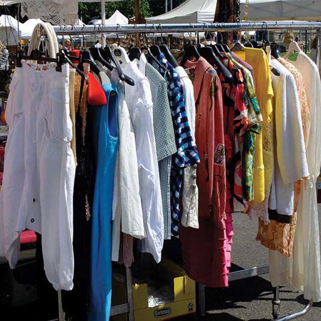 Rack of gently used clothes on rack for clothing exchange