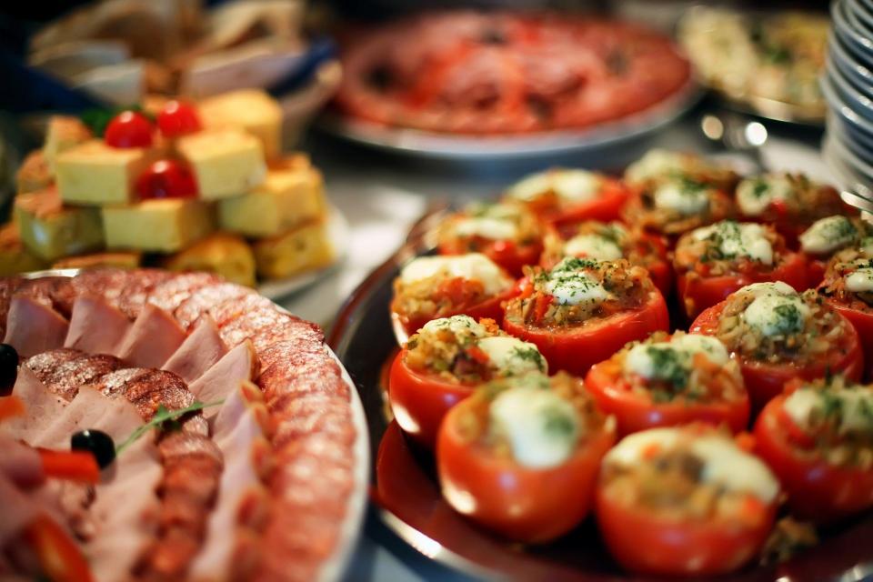 Variety of food out on serving table for potluck