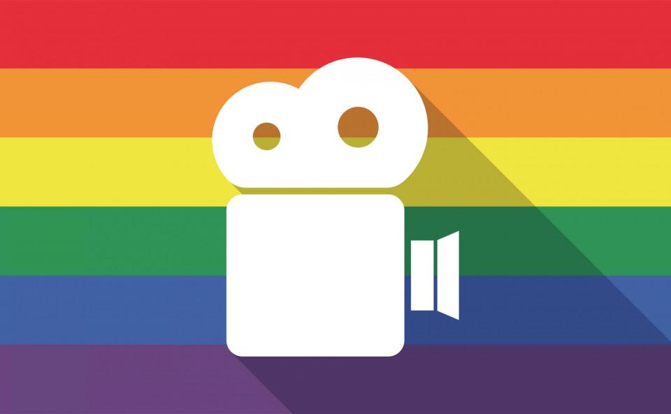 White drawing of a movie camera against rainbow flag background