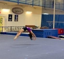 Female gymnast tumbling