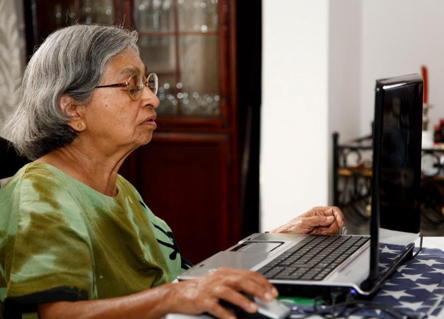 Senior Citizen using laptop computer