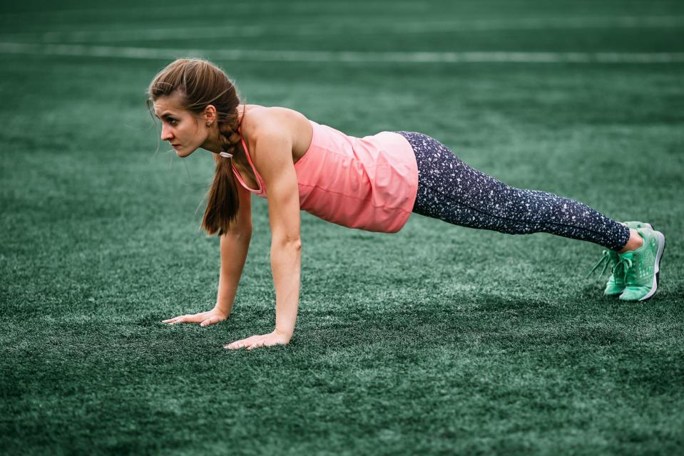 Woman doing exercised in park