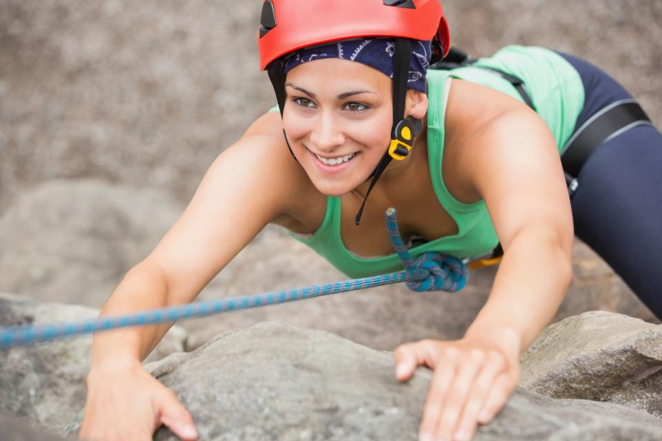 Woman rock climbing in the desert