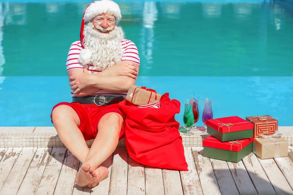 Santa by a swimming pool