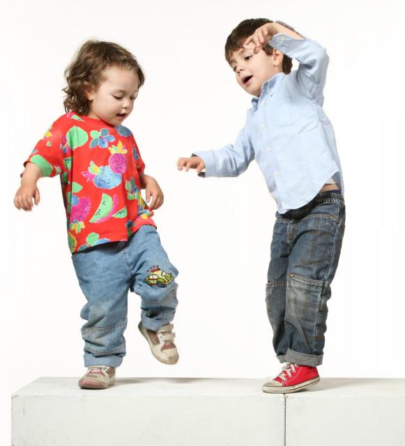 Preschool boy and girl dancing