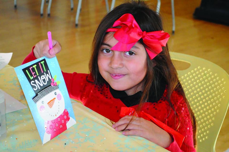 Hands folding paper for origami