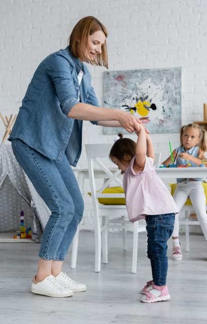 Parent and toddler dancing