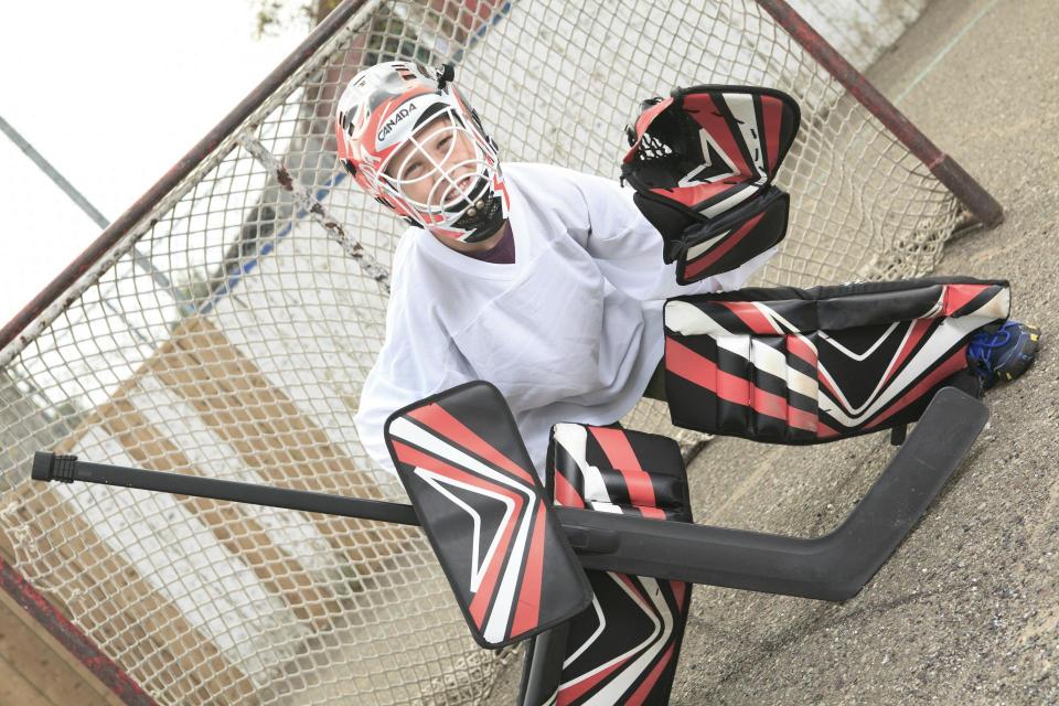 Street hockey player in front of goal