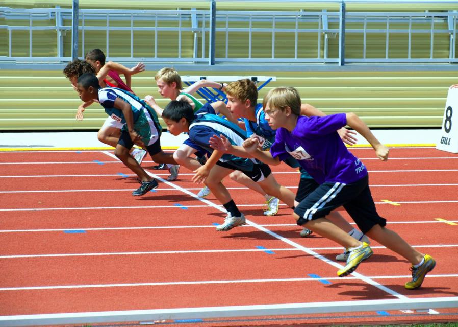Youth at start of track running event