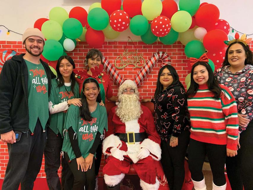 Mug of cocoa carried by Santa arms