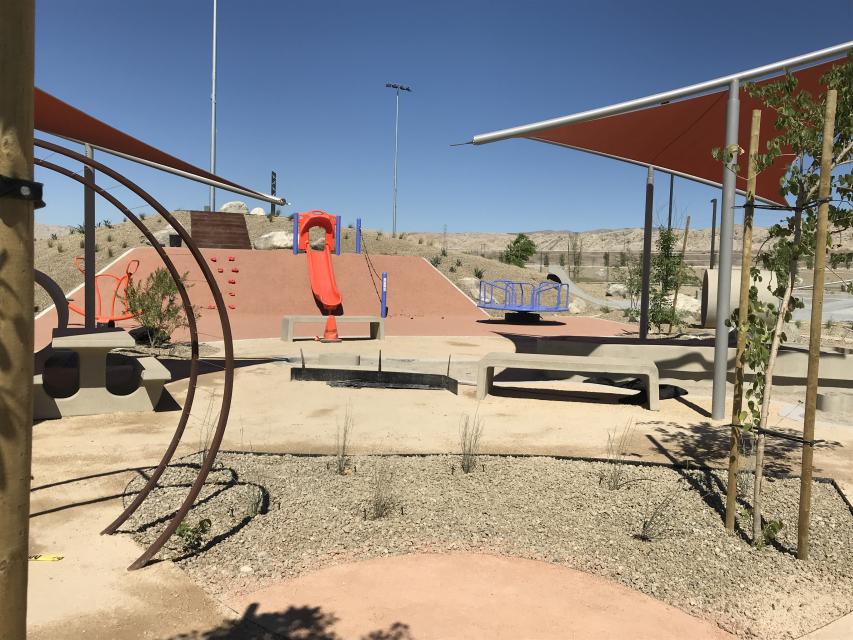 Inside the playground near the swing sets photo