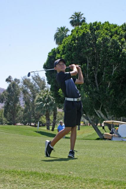 young man golfing