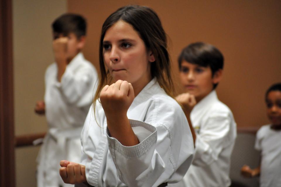 Photo of kids blocking in Karate class