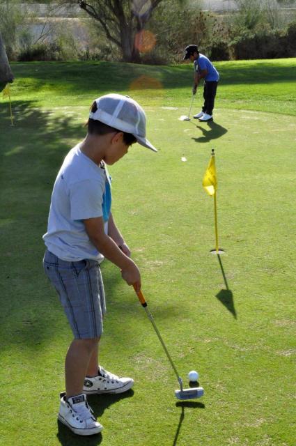 Boy playing golf