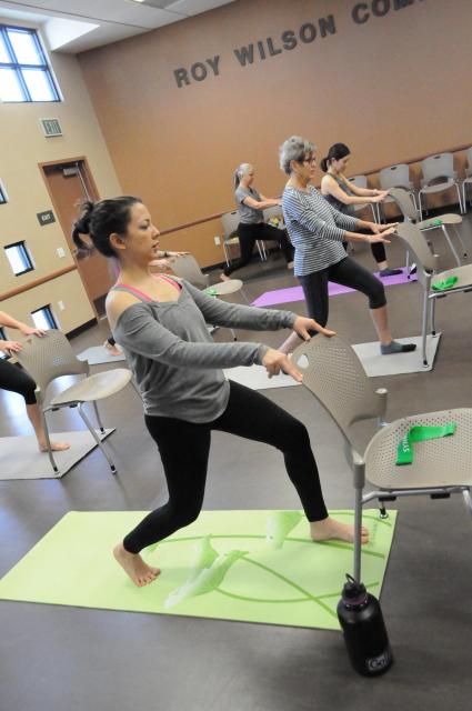 Women in a fitness class with mats