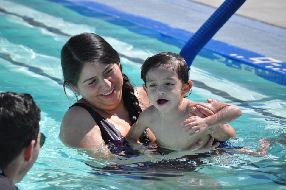 Mother and young son in a swimming pool