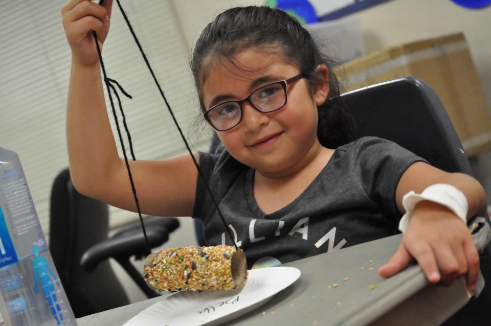 Young girl making a craft