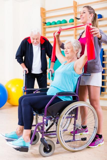 Woman in wheelchair exercising