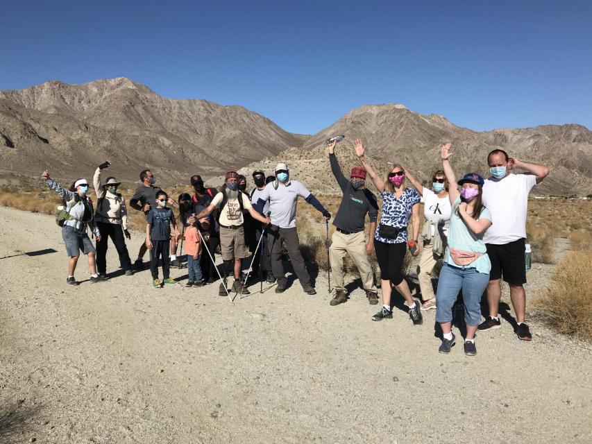 Group of people out hiking who stopped to take a photo