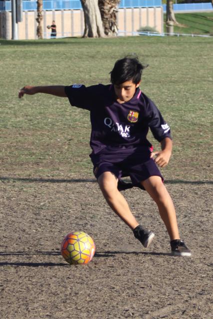 Youth playing soccer